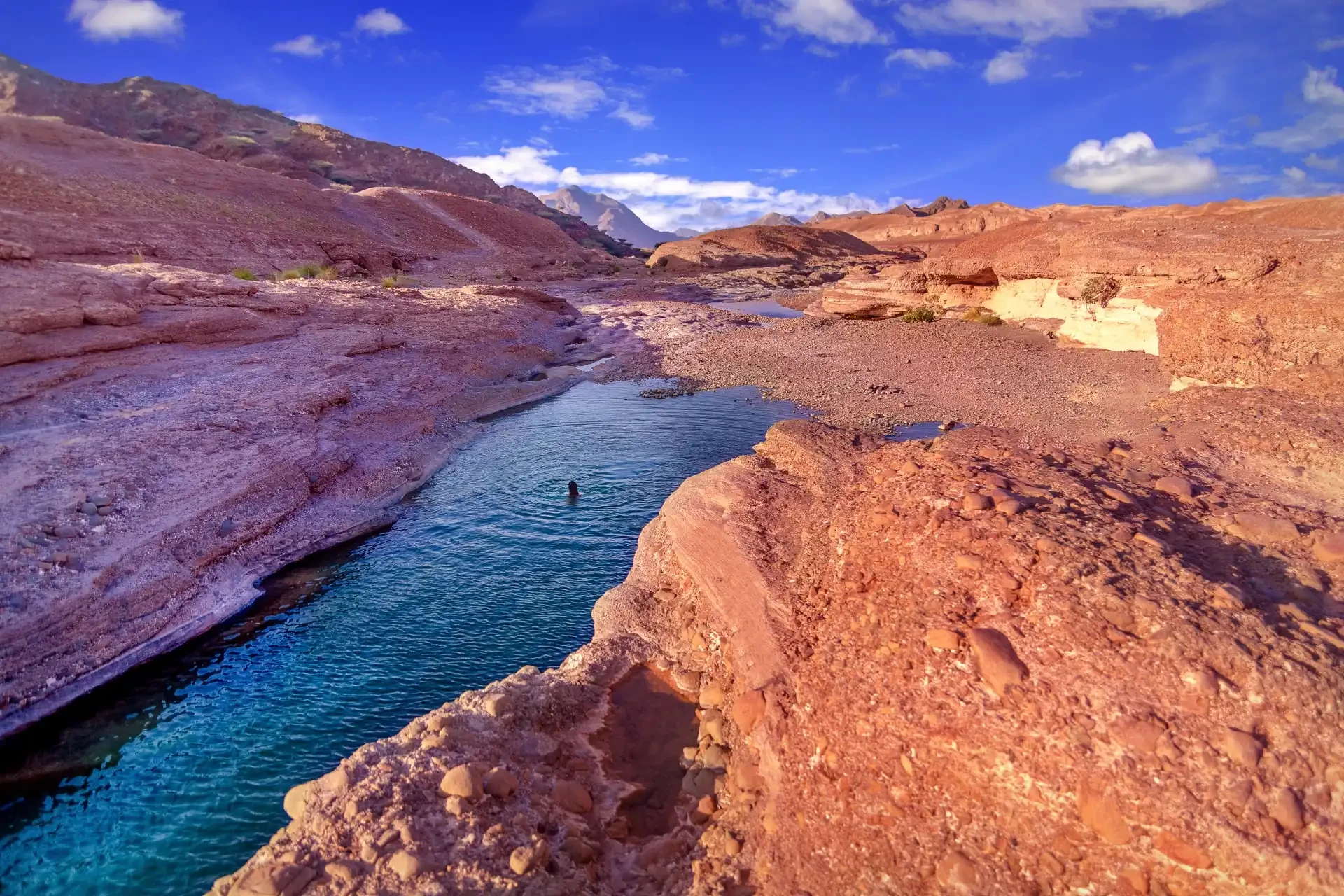 Hatta Pools Crystal-clear mountain pools surrounded by rugged terrain in Hatta, providing a serene and picturesque natural escape.