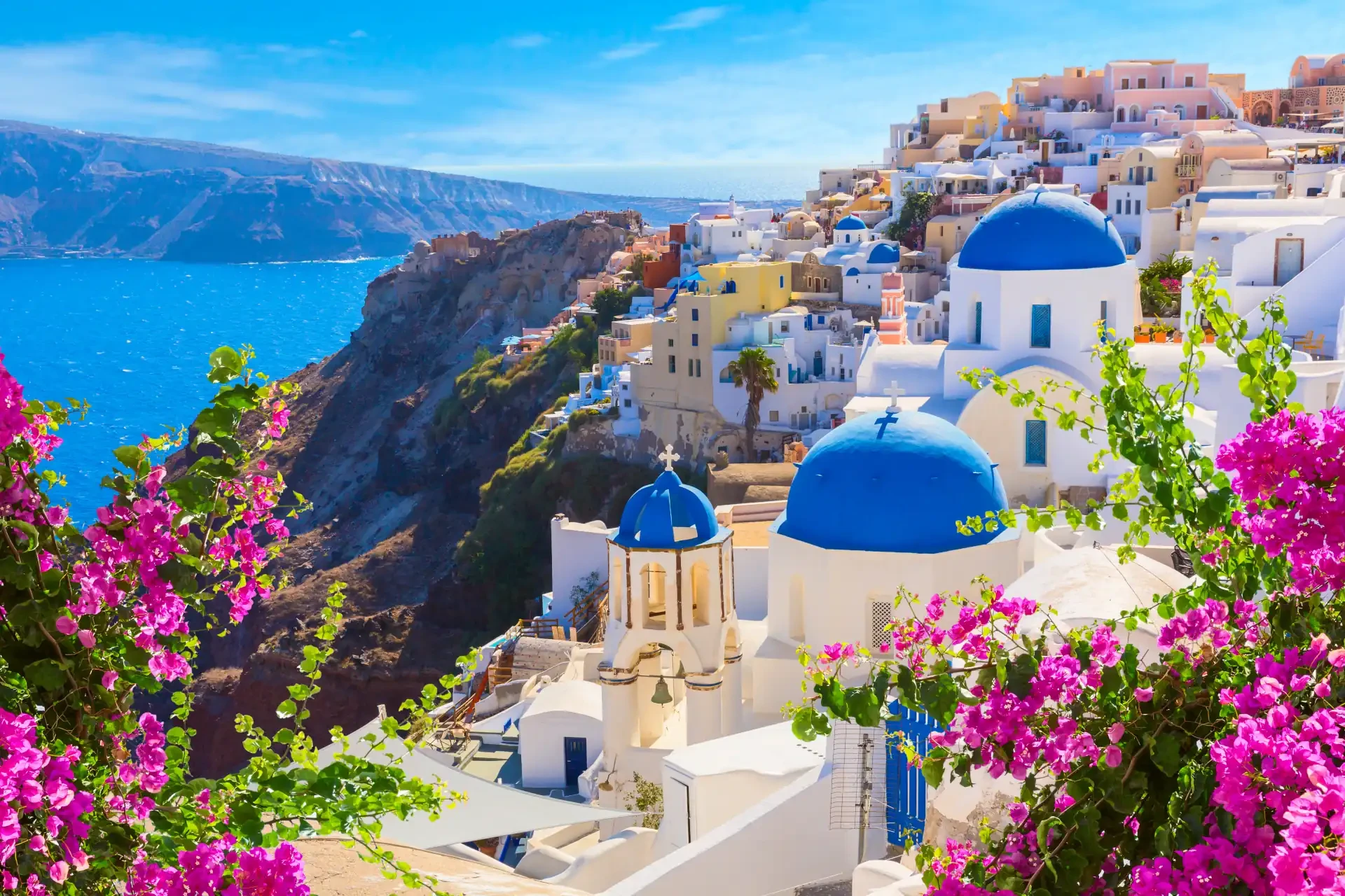 The blue roofs overlooking of Santorini, Greece, an example of a popular destination for tourists who can use a Greece eSIM and cheap travel data packages