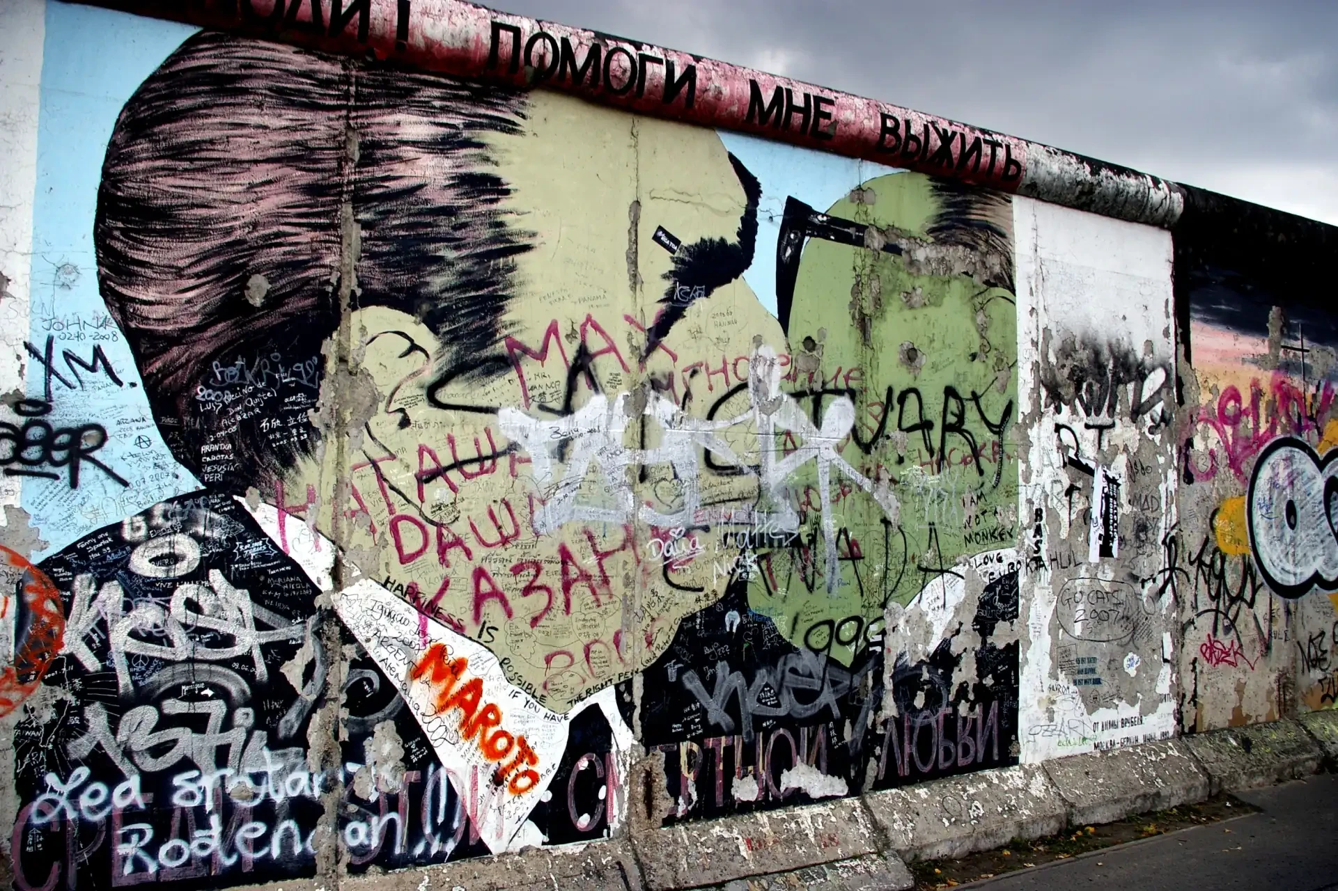 A graffiti painting by Dmitri Vrubel on the eastern side of the Berlin Wall, depicting Leonid Brezhnev and Erich Honecker in a socialist fraternal kiss.