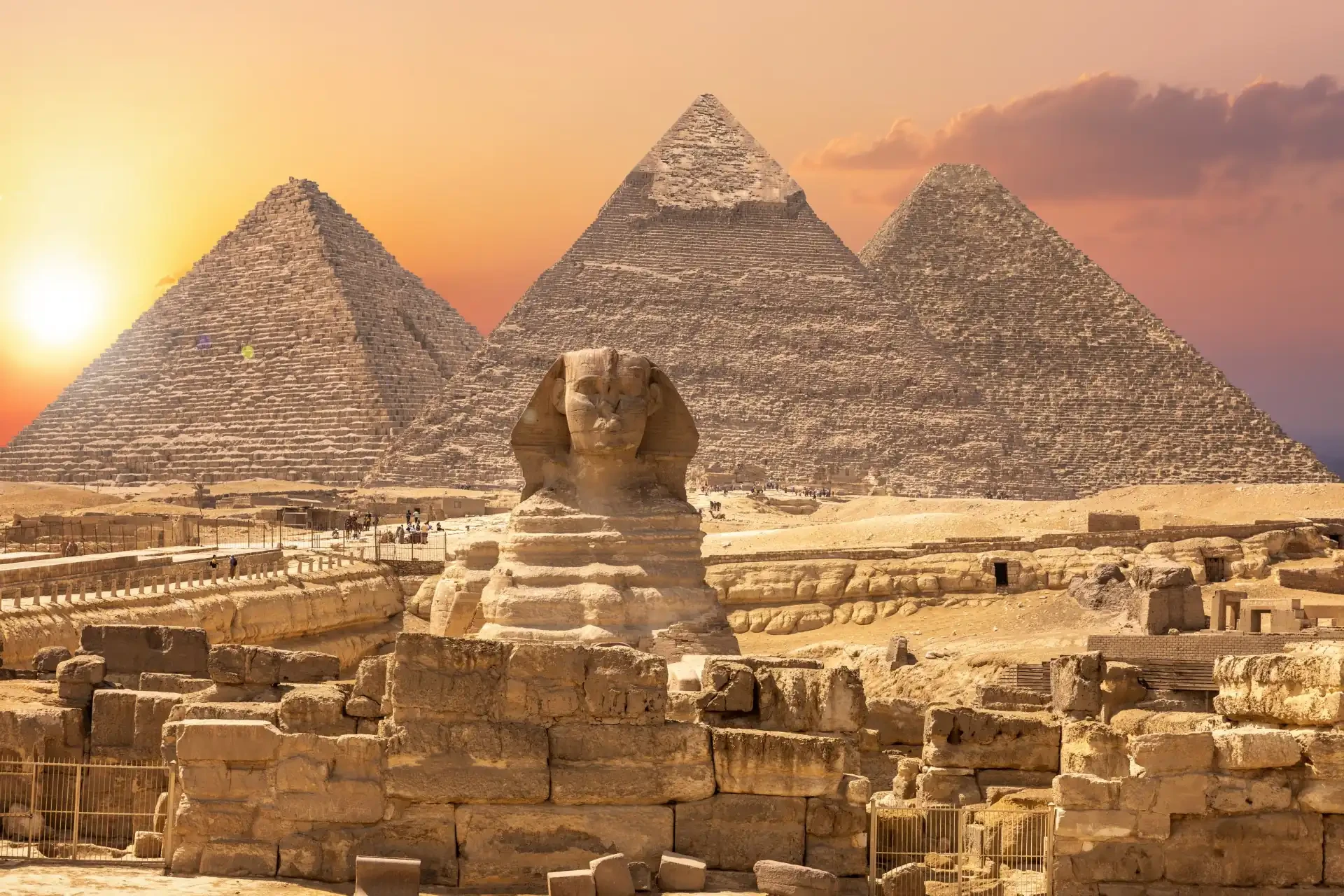 The Sphinx, a colossal statue with a lion's body and a pharaoh's head, overlooking the Great Pyramid.