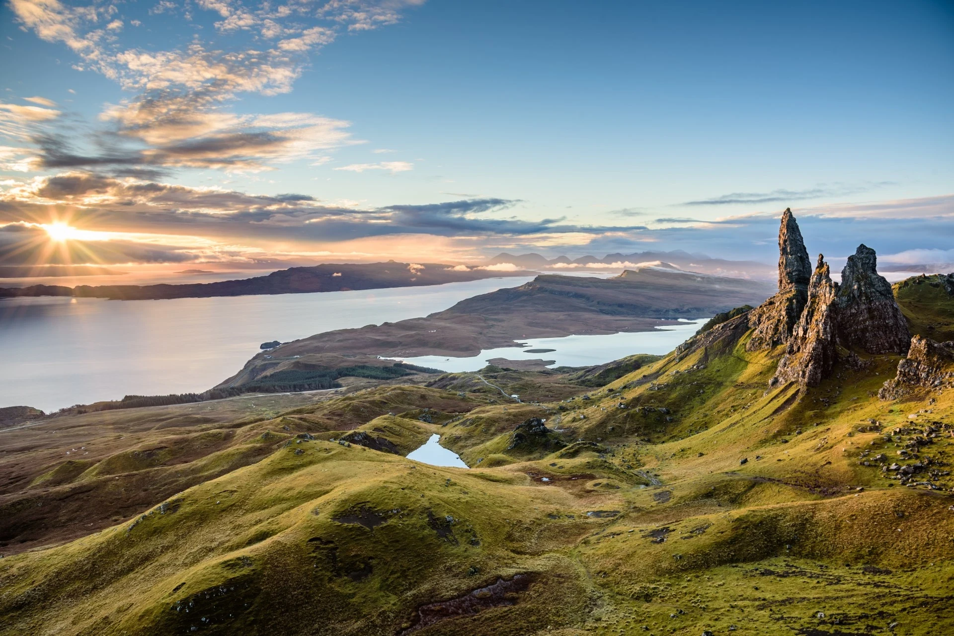 The rugged beauty of the Isle of Skye is revealed through dramatic cliffs and picturesque coastal scenery.