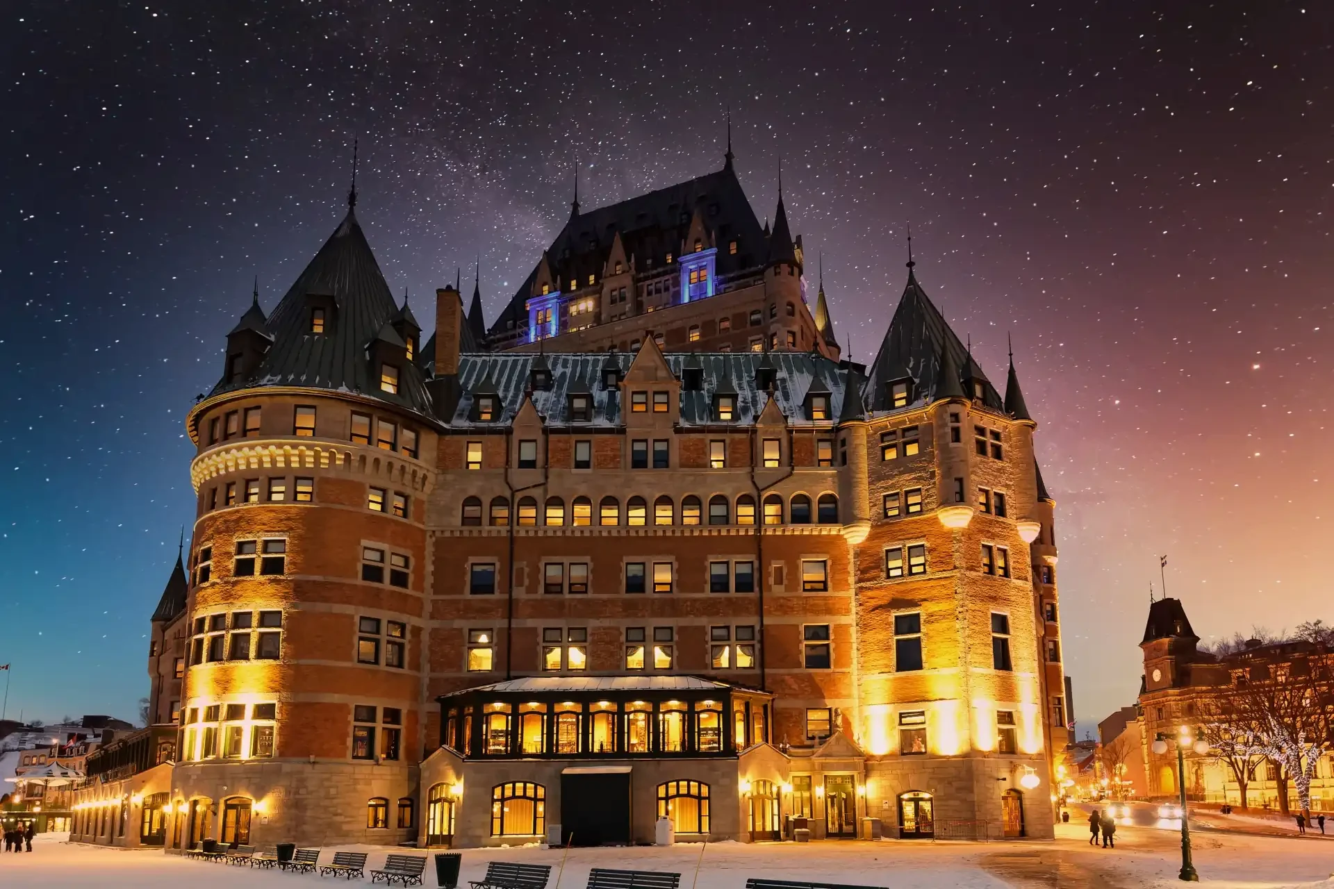 Fairmont Château Frontenac in Québec City at dusk, an iconic and historic hotel overlooking the cityscape.