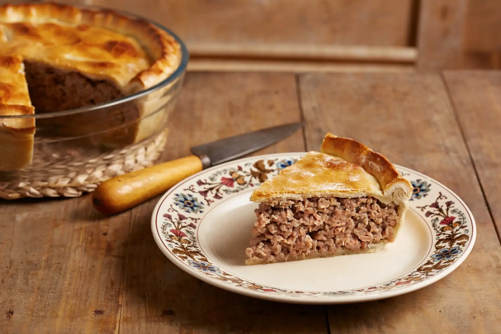 A slice of tourtière, a traditional French-Canadian meat pie, often enjoyed during festive occasions.