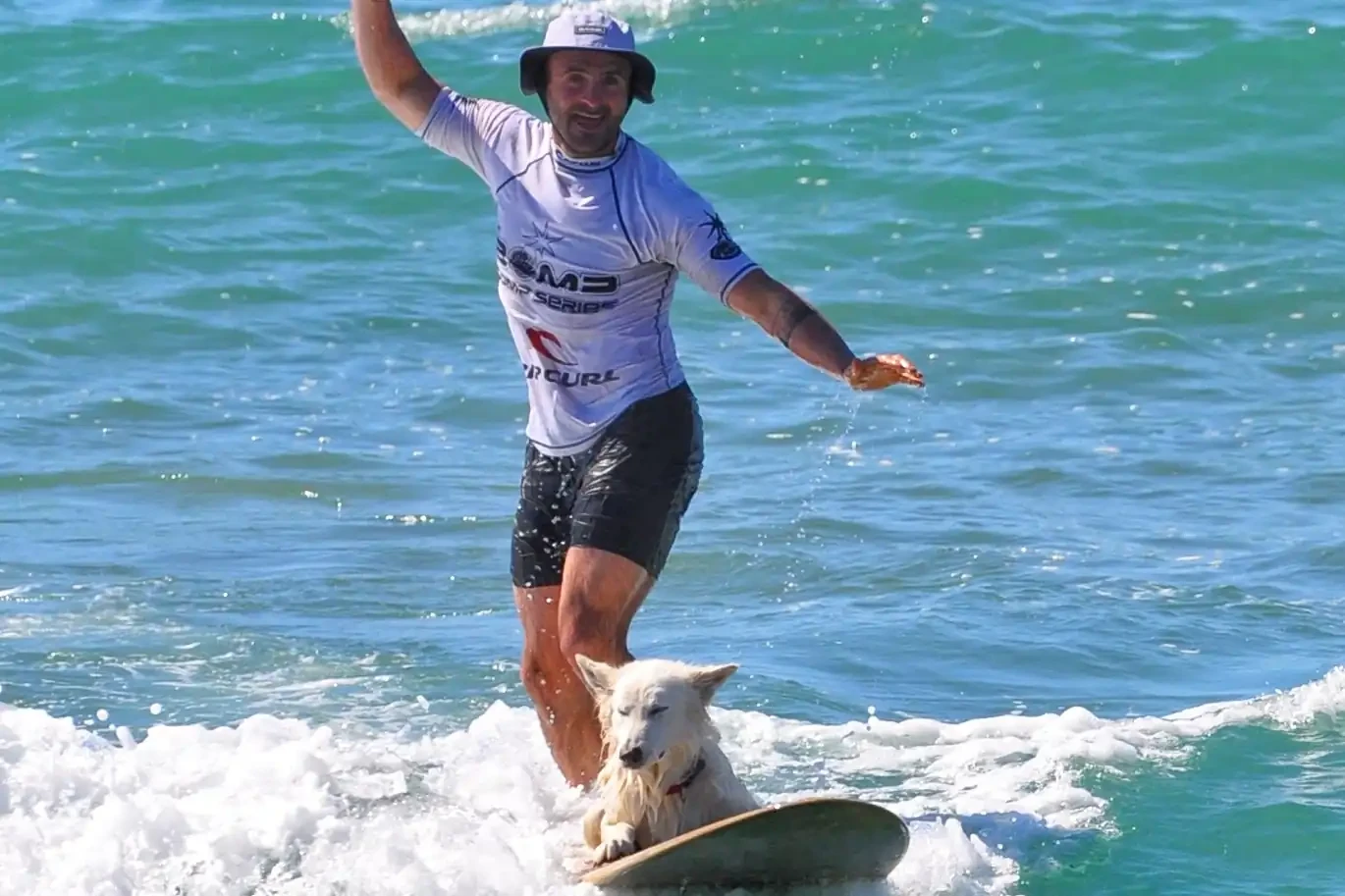 Bobby surfing with dog