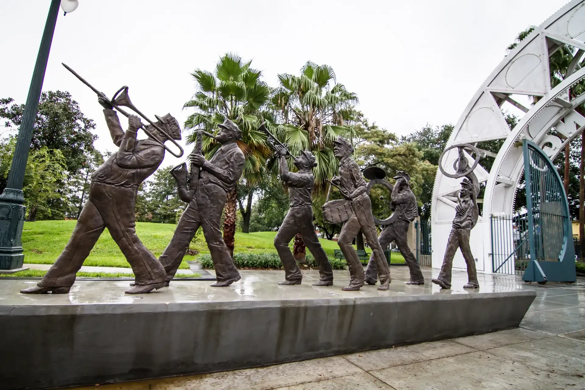 A bronze statue of a jazz brass band at Louis Armstrong Park in New Orleans, Louisiana, capturing the lively spirit of the city's musical heritage.