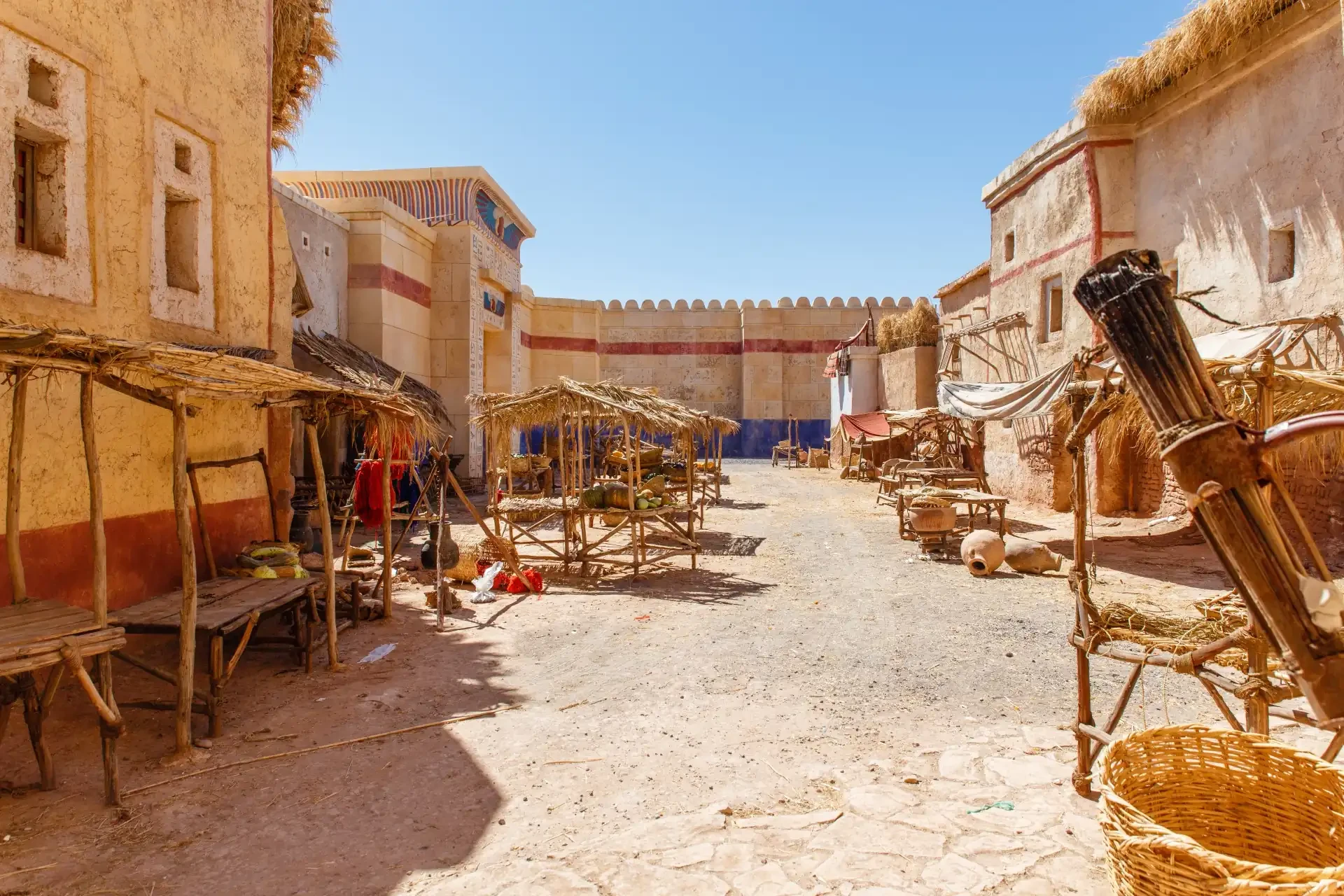 A set at the Atlas Film Studio in Ouarzazate, Morocco. Wooden structures, wicker baskets and terracotta pots.