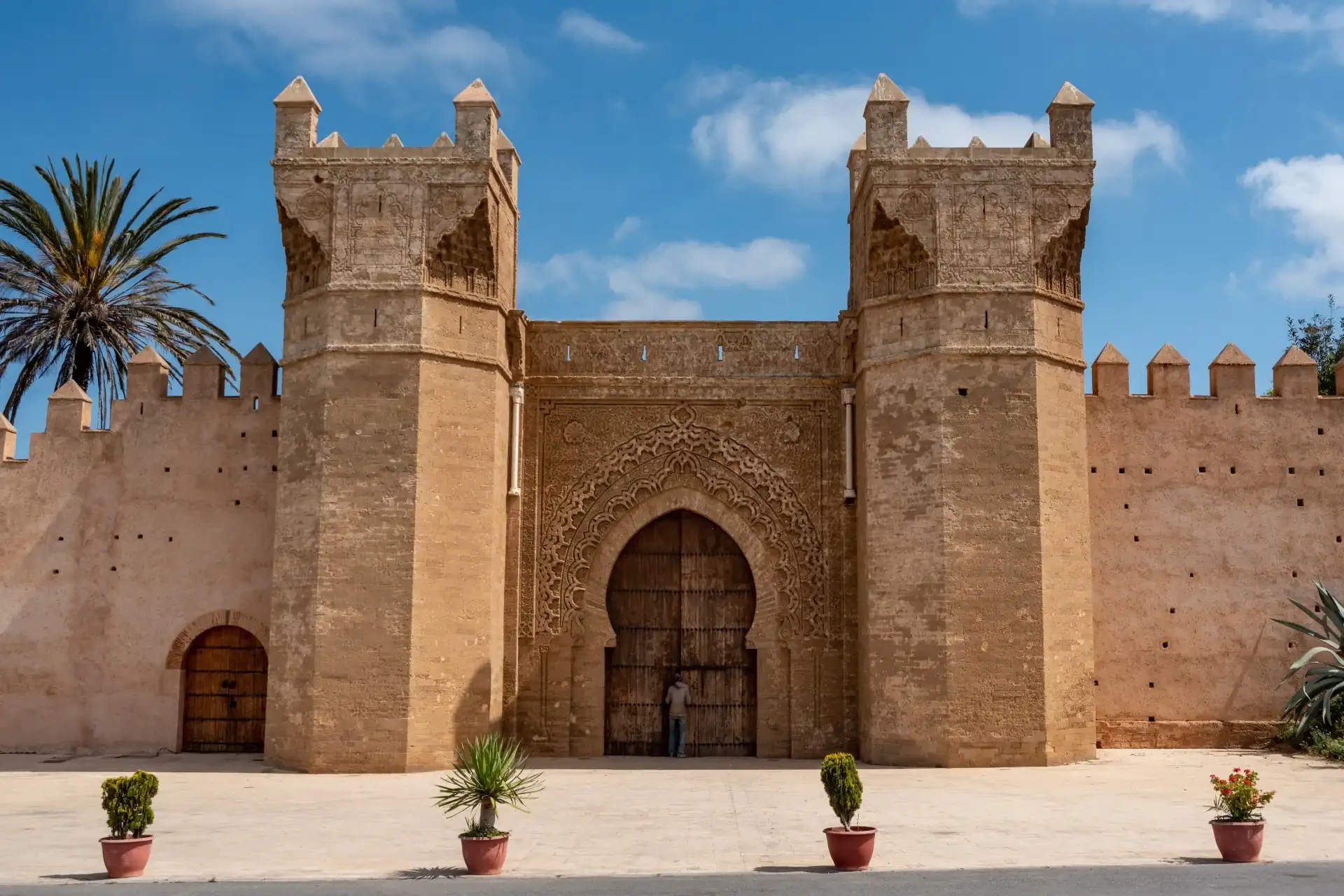 People standing at the Gate of Chellah, Morocco