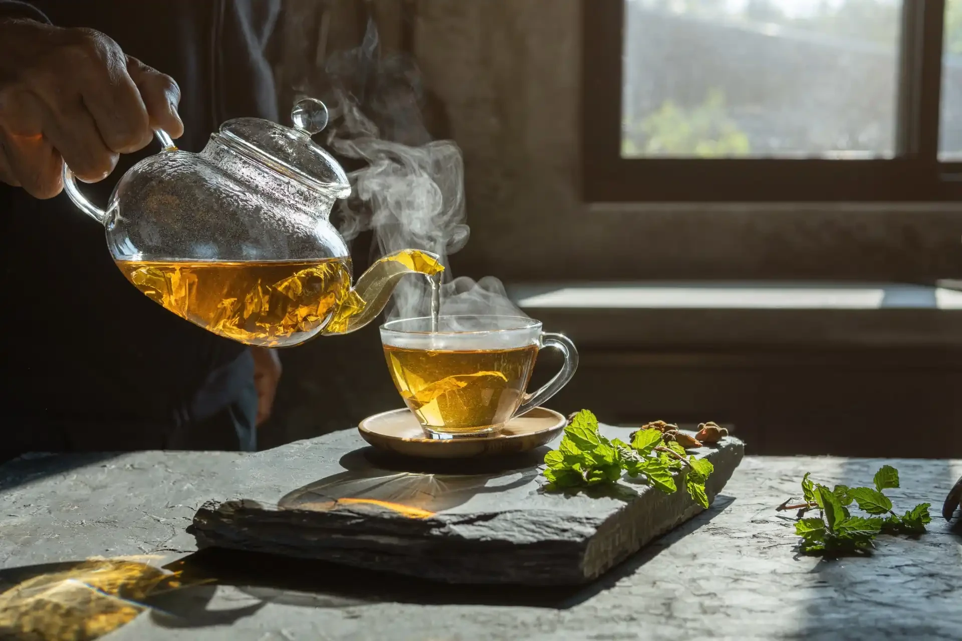 Traditional Moroccan mint tea served in ornate glasses on a tray.