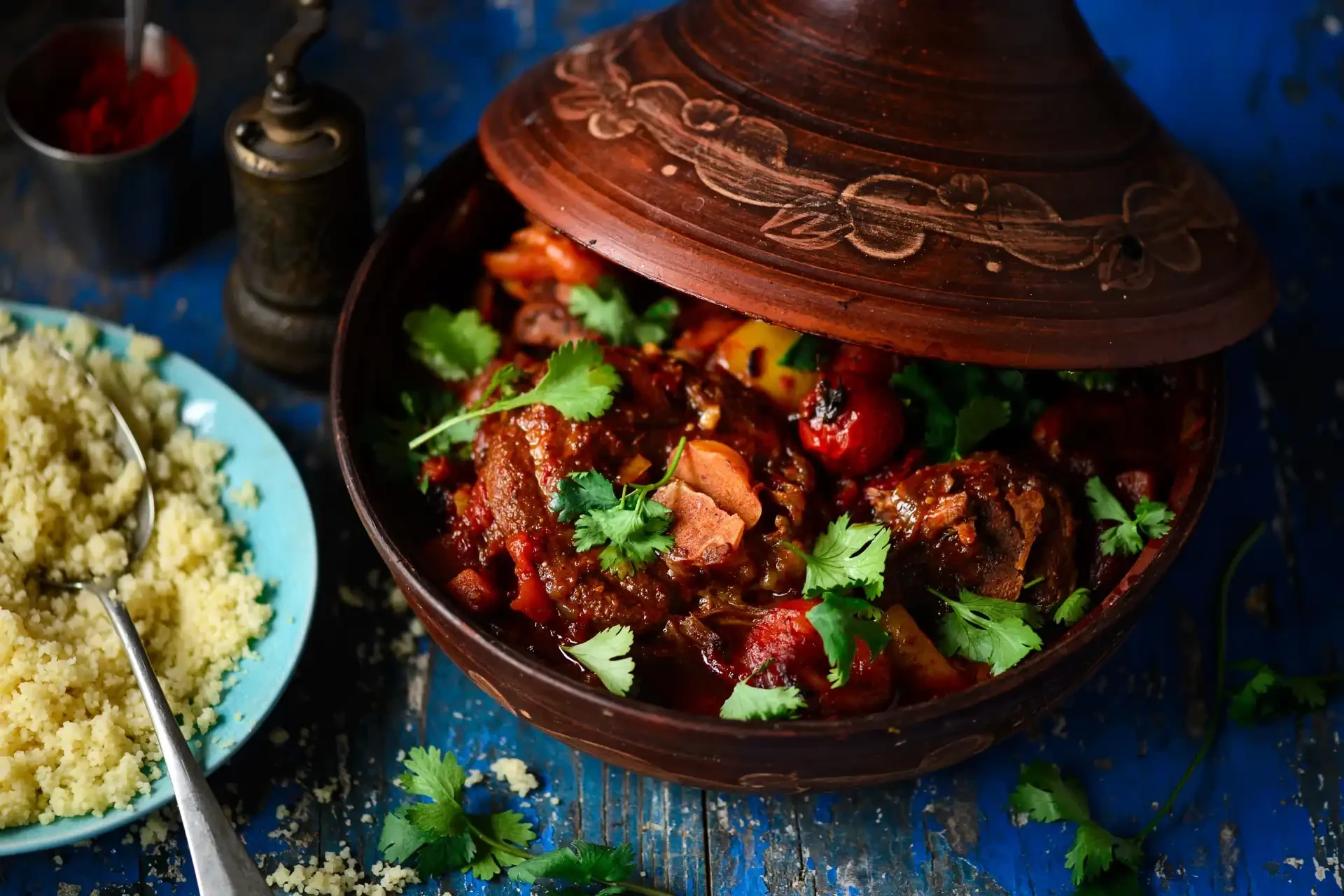 Traditional tagine dish served with a side of Moroccan couscous.