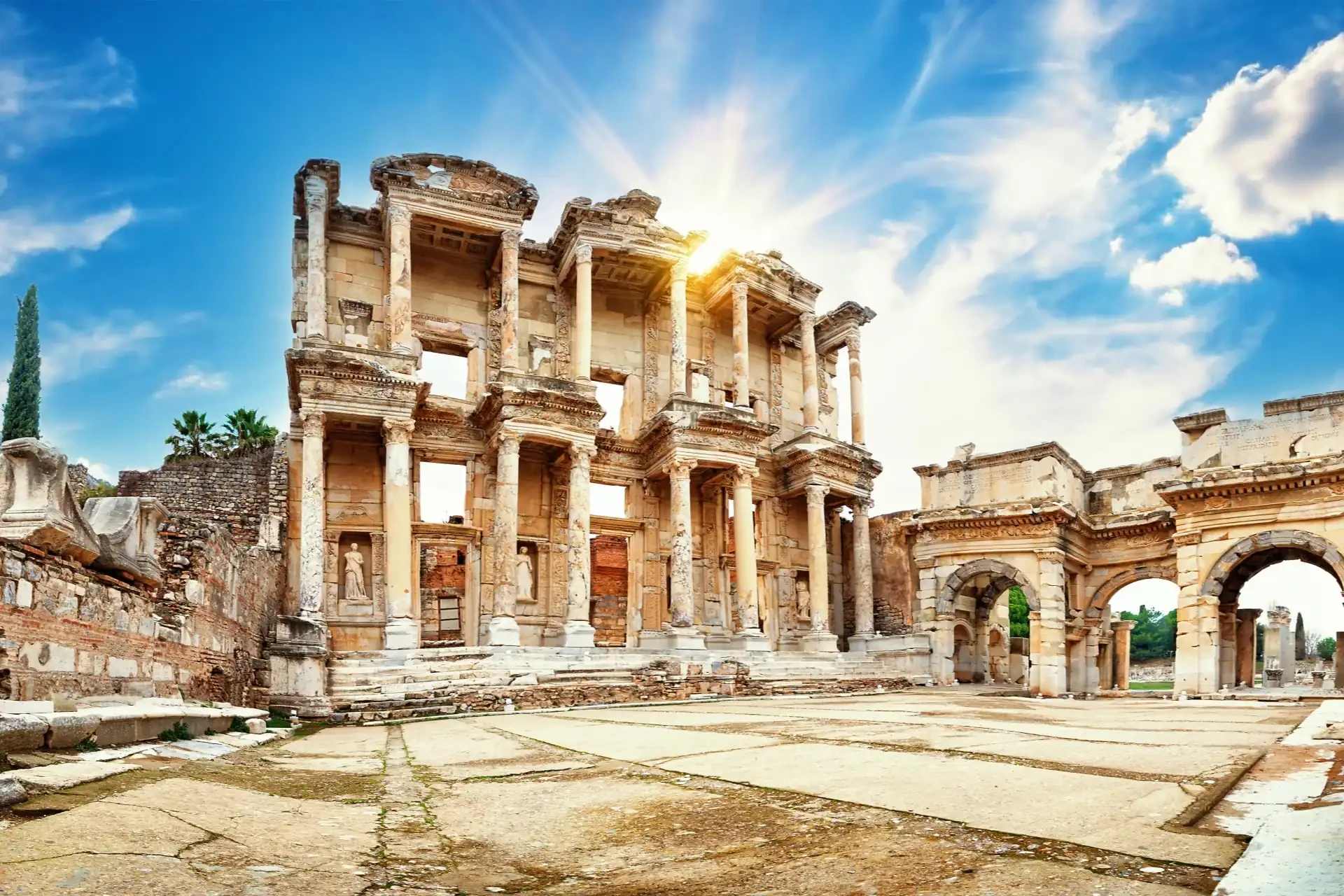 The ruins of Ephesus, an ancient city with well-preserved historical structures in front of a blue sky.